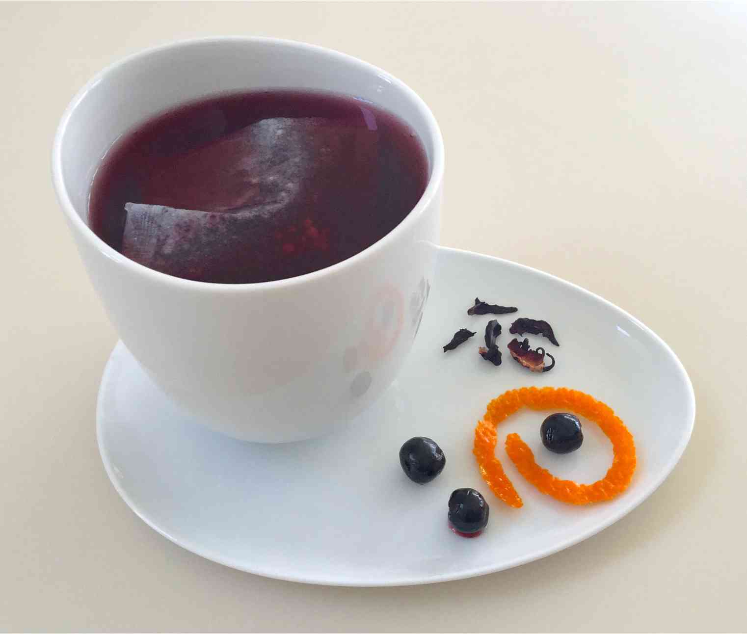 Sunny Lane Farms aronia tea showing its ingredients next to cup, photo by Peter Laundy